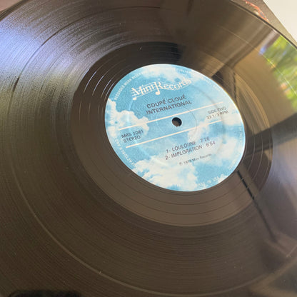 Coupé Cloué - The World Of Coupé Cloué (L'International) - LP 1979 Occasion